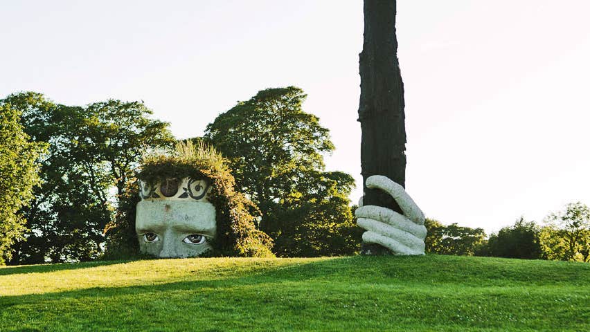 Dún na Sí Amenity and Heritage Park view of large ancient Celt head and hand sculpture