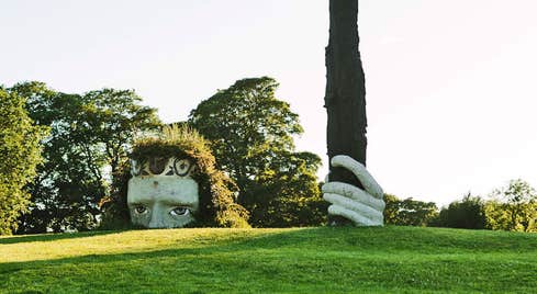Dún na Sí Amenity and Heritage Park view of large ancient Celt head and hand sculpture