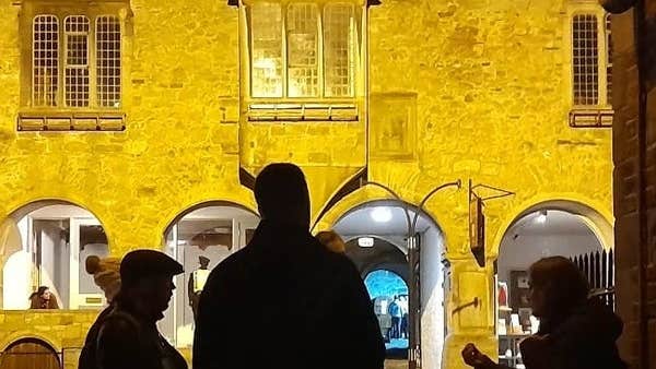 On a night tour in front of Rothe House in Kilkenny City