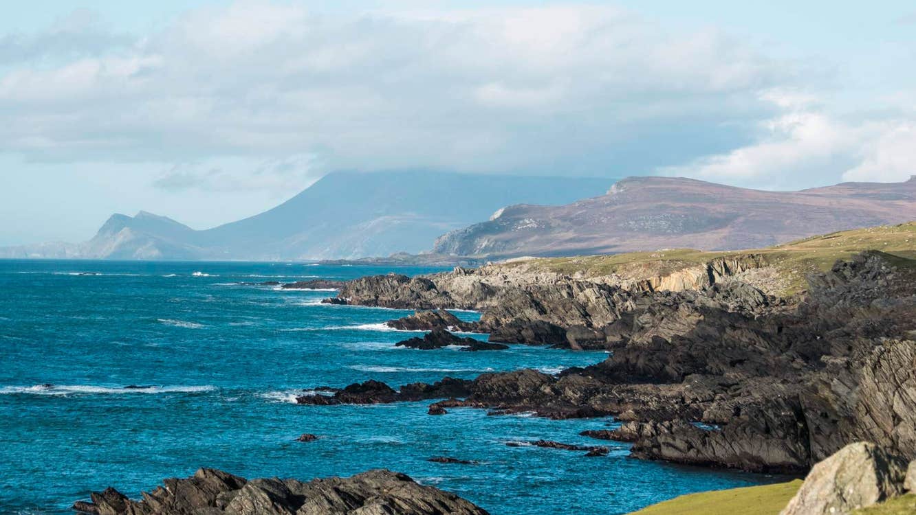Vivid blue water of Ashleam Bay in County Mayo.