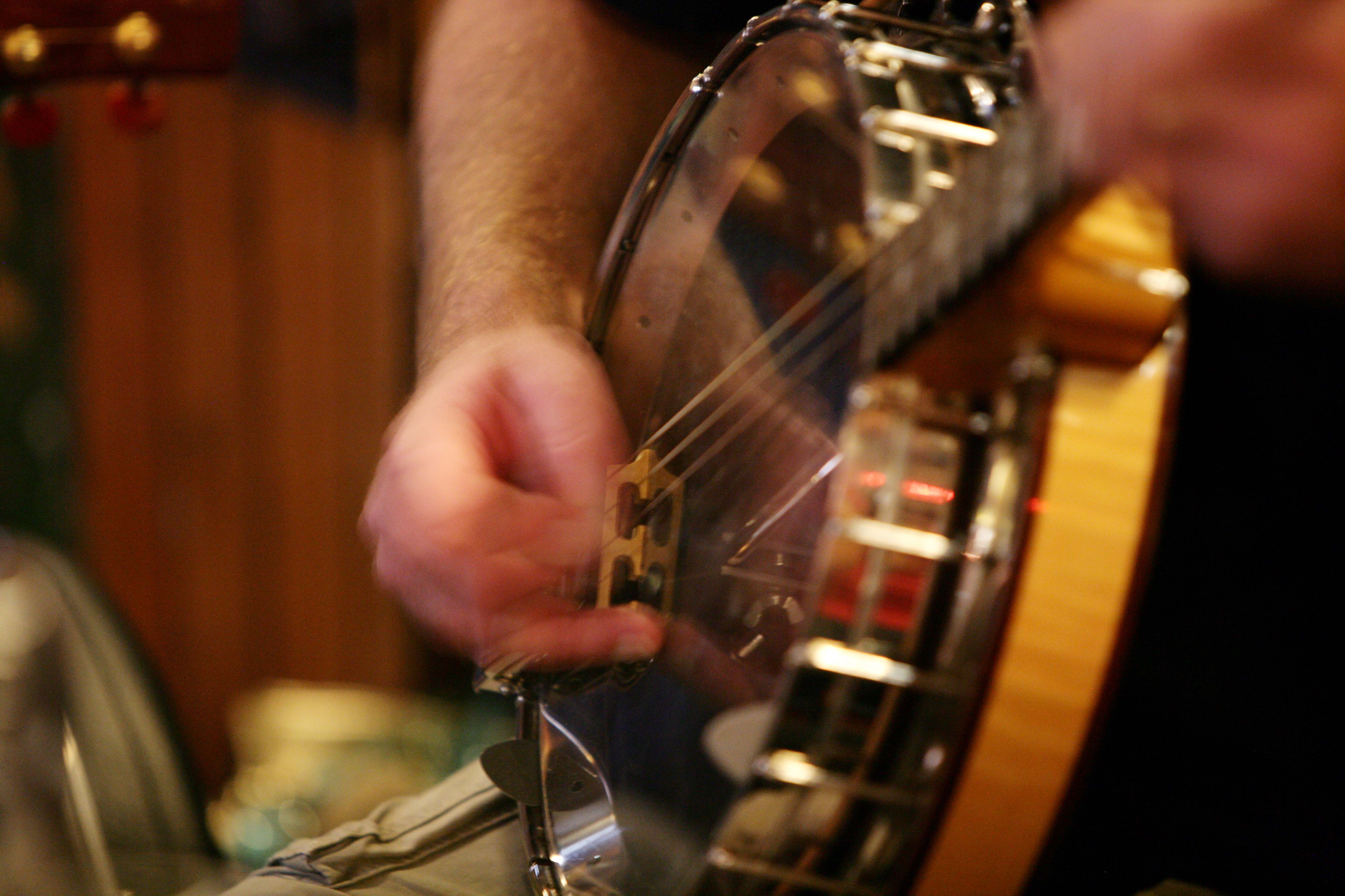 A traditional Irish musician playing banjo.