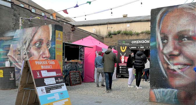 Phoenix Yard Market in Waterford, entrance with murals of two women