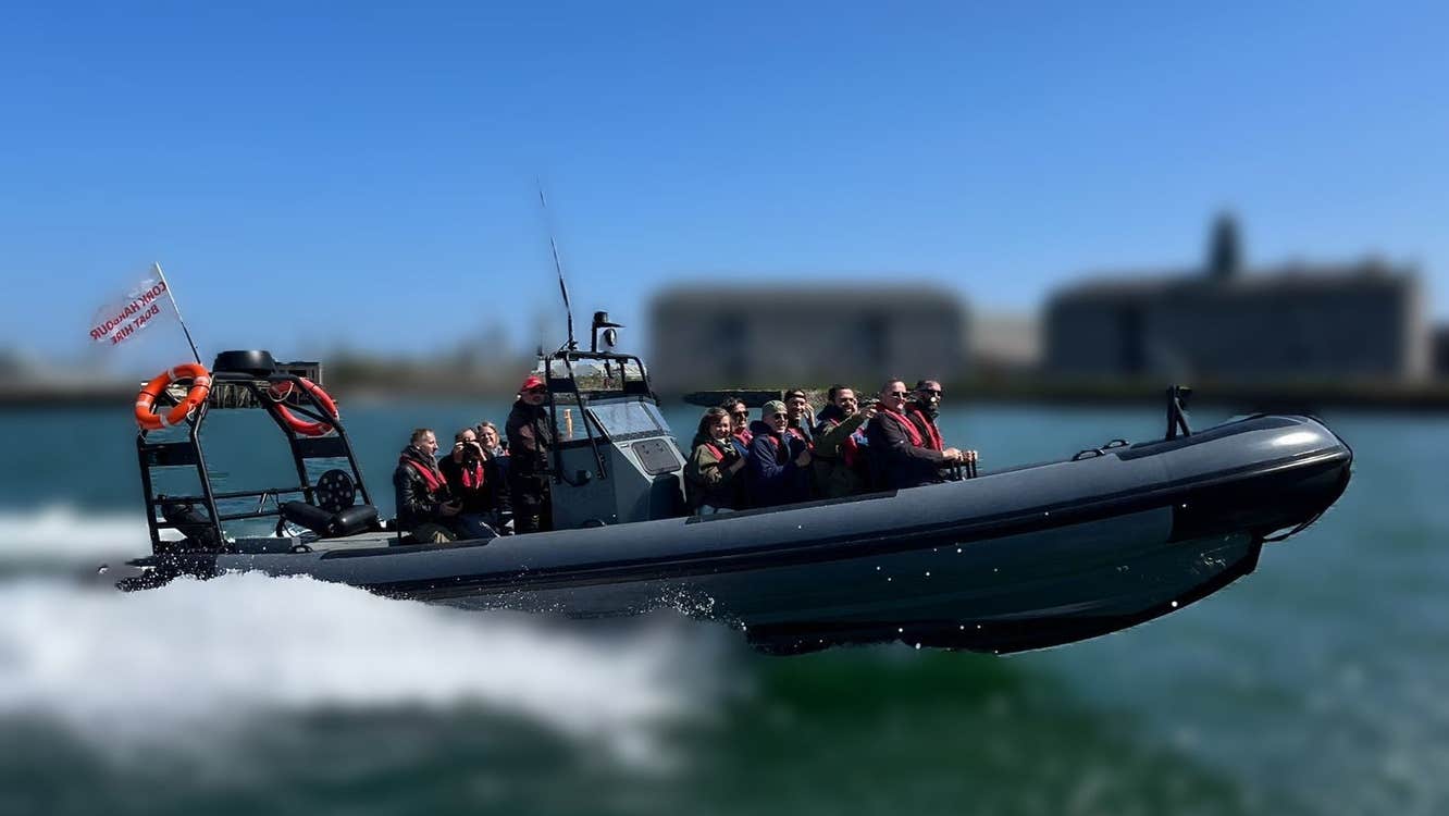 Group of people on a small boat out at sea