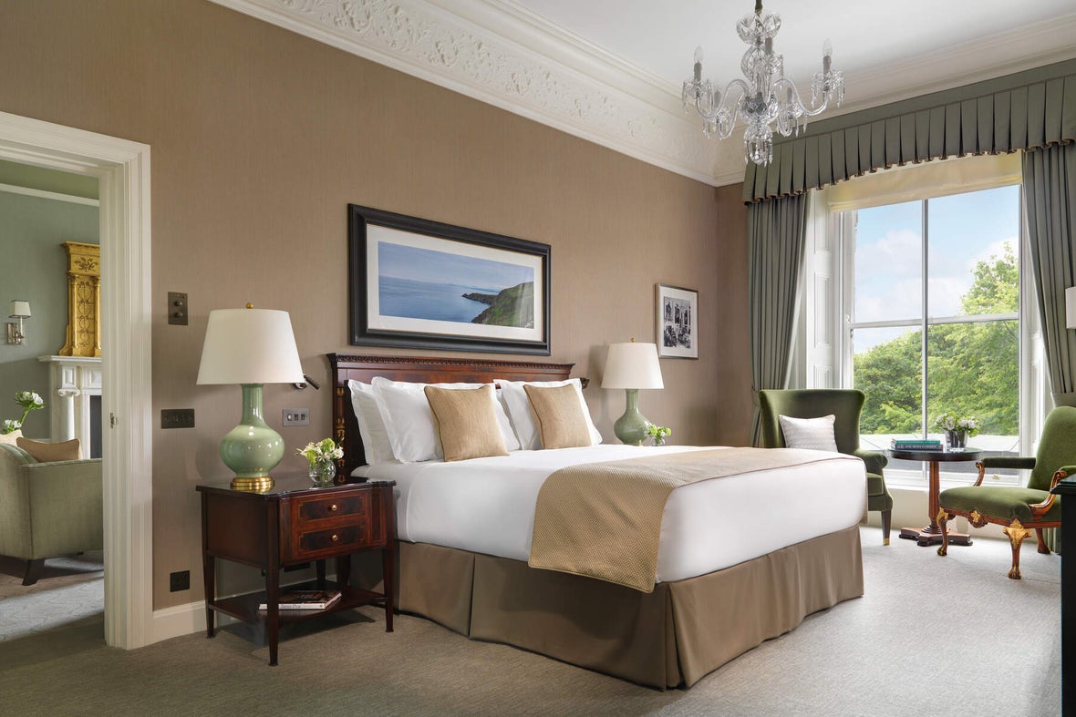 Interior of room at the Shelbourne Hotel in Dublin with white and tan furnishings.