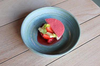 A strawberry and coconut dessert served at Bastible