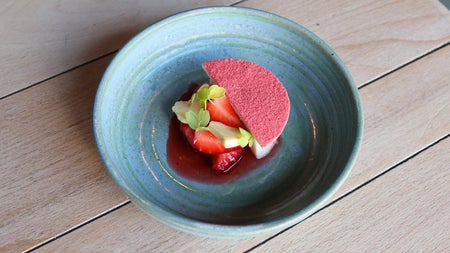 A strawberry and coconut dessert served at Bastible