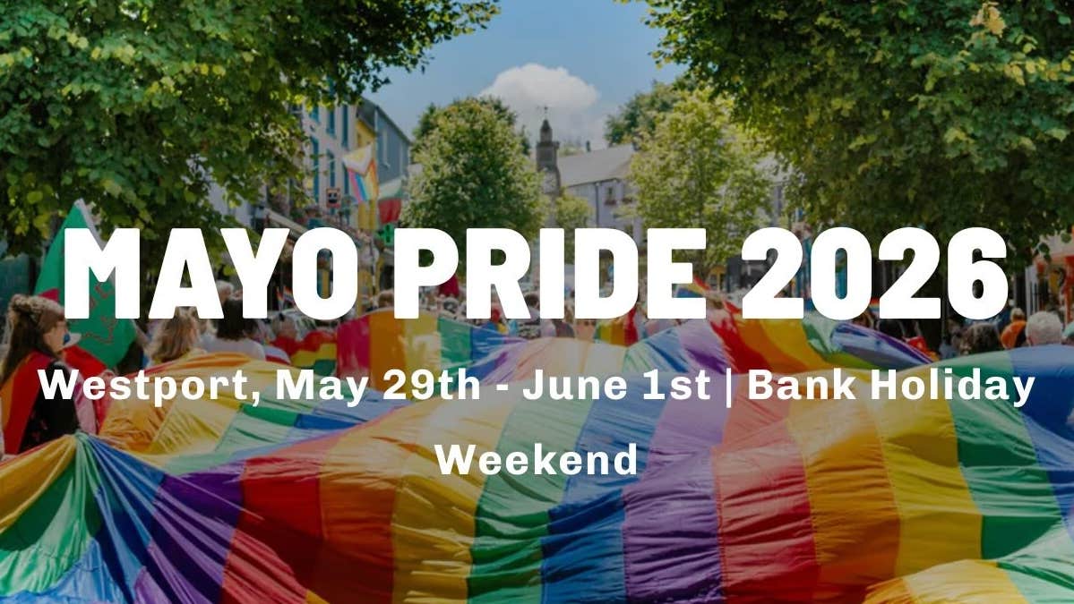 A large rainbow coloured flag is being carried flat along a busy street by lots of people overlaid with white event text info.