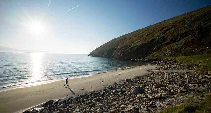Image of walker on Keem Beach, Achill Island, County Mayo