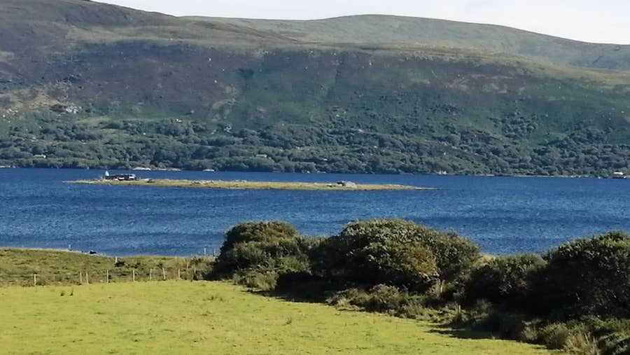 A view of Church Island and the medieval ruins in the middle of Lough Currane in Waterville