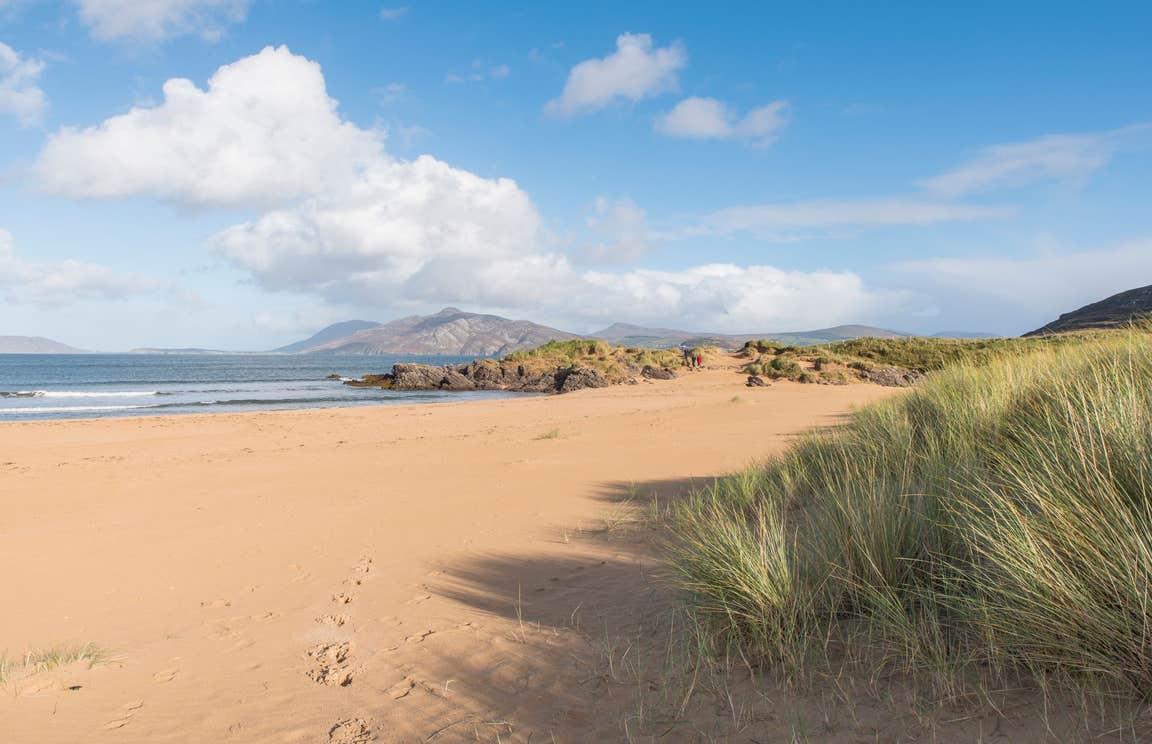 Footprints in the sand leading to the sea at Ballymastocker Beach, Donegal, Wild Atlantic Way.