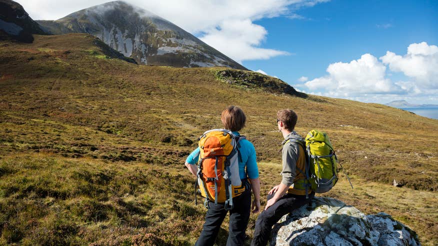 Two hikers looking at Croagh Patrick in County Mayo