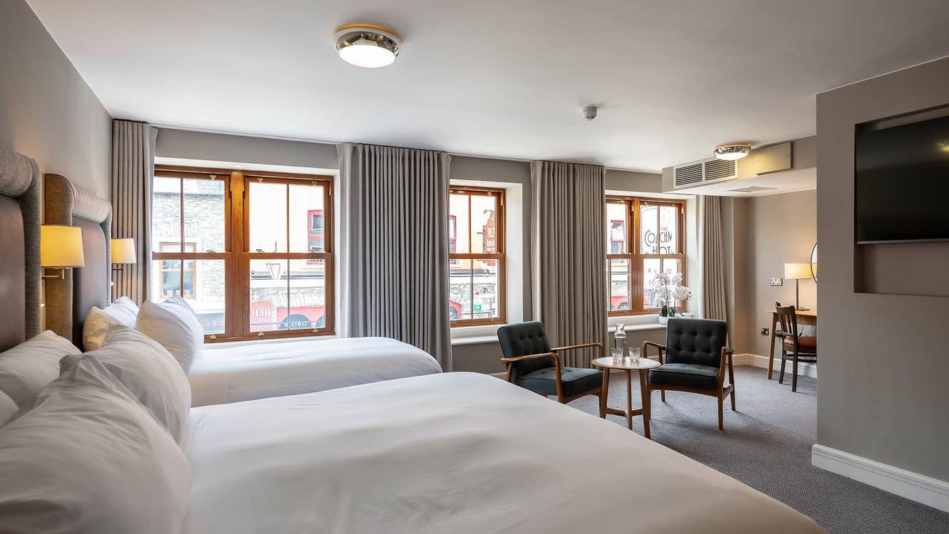 Bedroom with two beds and seating area