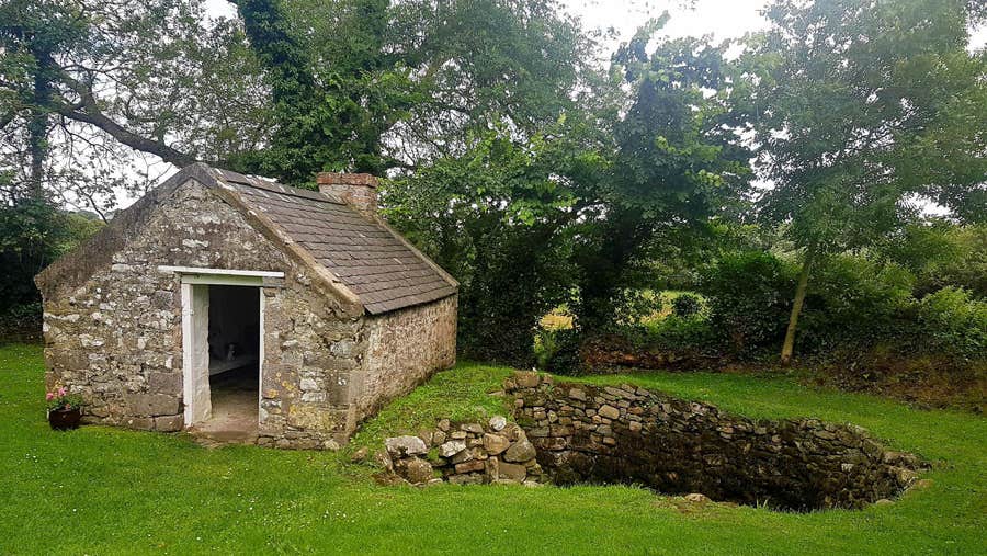 A view of the Tobar Na Molt holy well and nearby shelter building