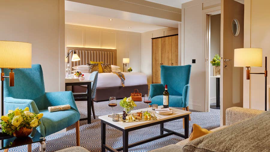 Junior suite with comfortable chairs.