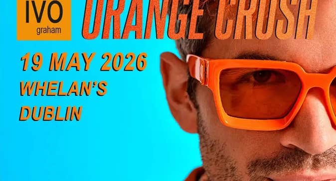 Close up view of right side only of a man's face wearing orange sunglasses