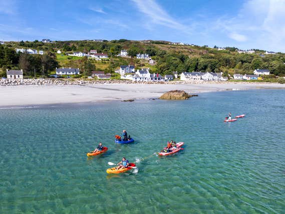 People kayaking at Cumann na nBad on Arranmore Island in Donegal