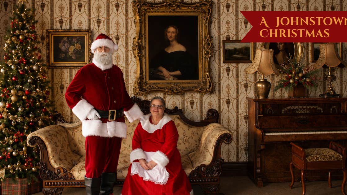 Santa and Mrs Claus pose for a photo in our drawing room.
