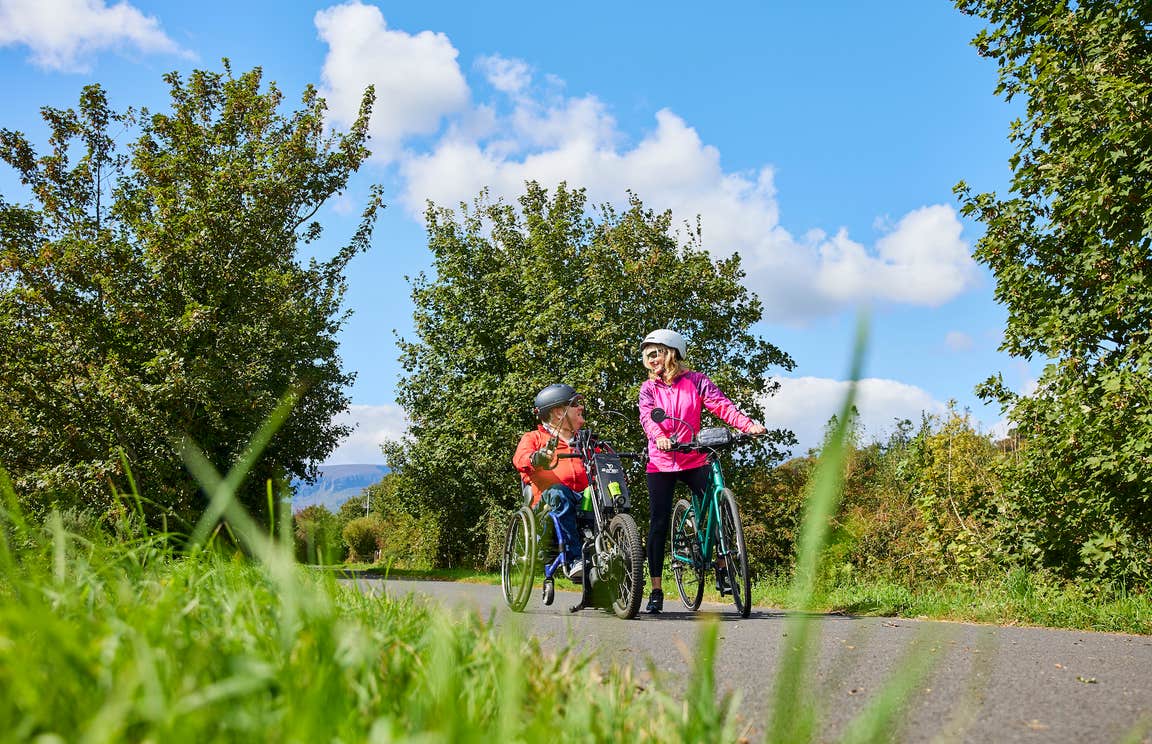 People cycling the Waterford Greenway