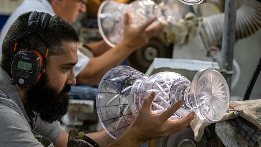 Craftsman working on a piece of Waterford crystal
