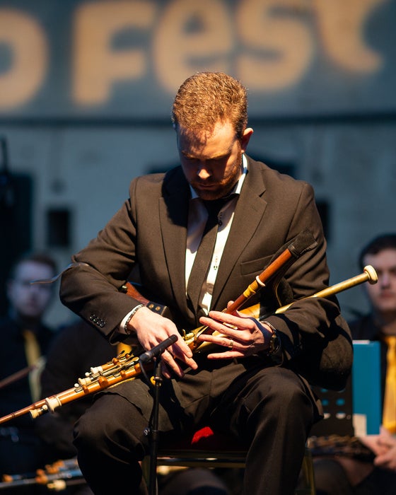 A trad musician performing at TradFest in Dublin city