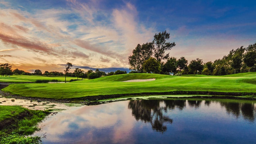 A view of the water feature and greens at St Margaret's Golf & Country Club