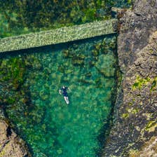 Someone swimming in Poll Gorm Natural Swimming Pool in Easkey, Co Sligo