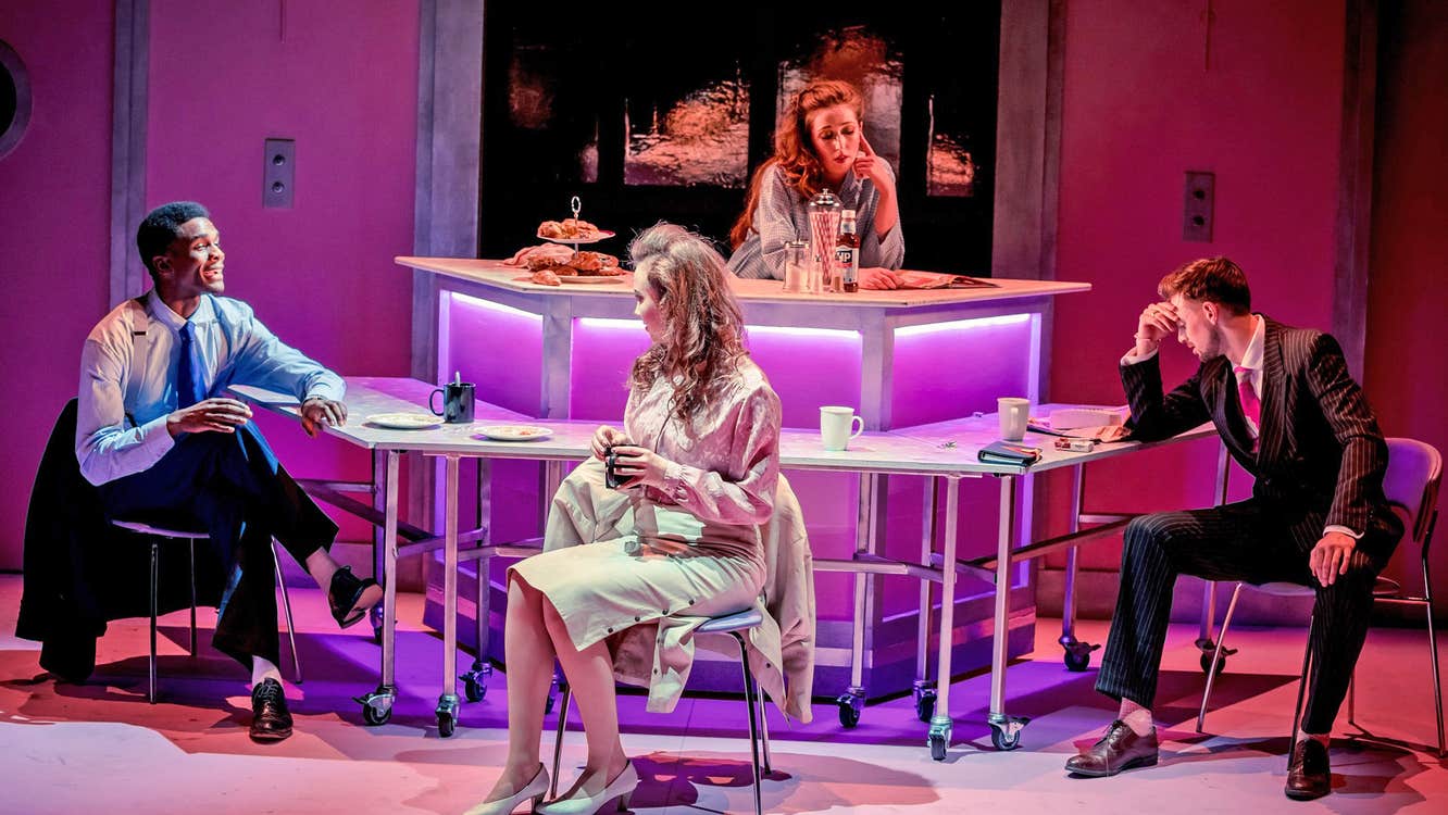 The Lir Academy view of four people performing on stage in a modern bar scene