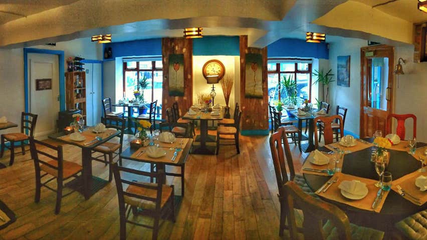 Interior image of Blue Serenade Restaurant with tables set for dinner