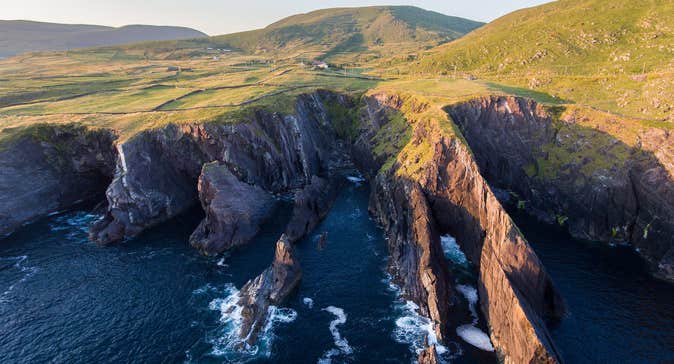 Green fields and cliffs at Skellig Ring, Co. Kerry