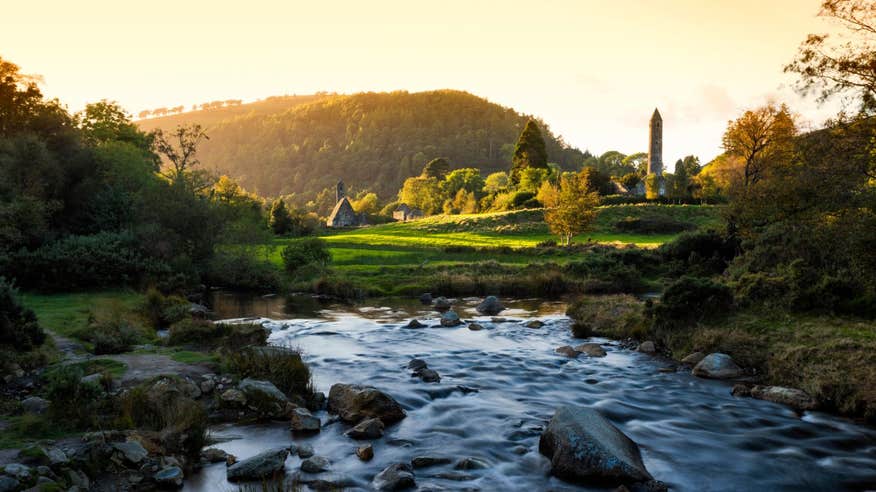 Sunset views of the mountains and round tower at Glendalough
