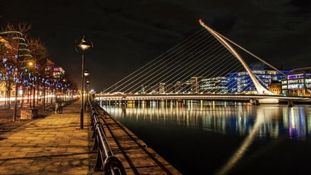 The harp shaped Samuel Beckett Bridge in Dublin City pictured when it is illuminated at night