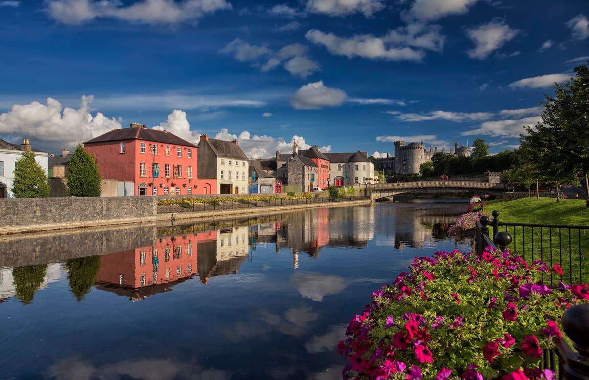 Reflections of colourful buildings on a river in Kilkenny City, Kilkenny