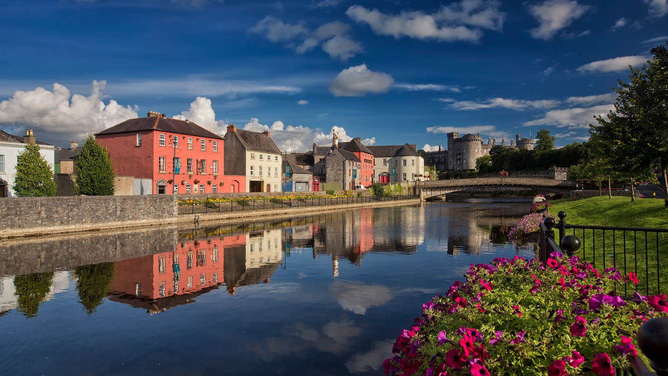 Reflections of colourful buildings on a river in Kilkenny City, Kilkenny