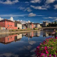 Reflections of colourful buildings on a river in Kilkenny City, Kilkenny
