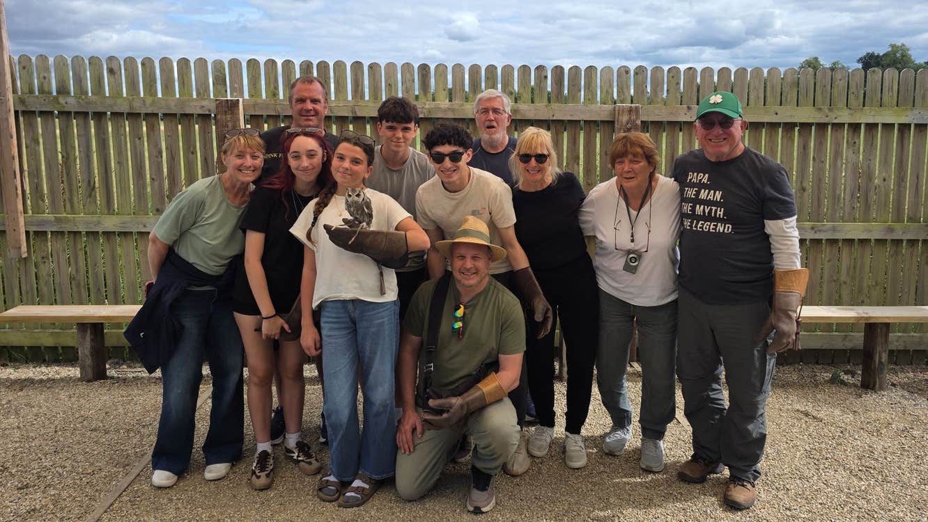 A tour group lined up for a group photograph