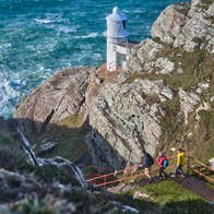 People walking the Sheep's Head Lighthouse Loop in Co Cork