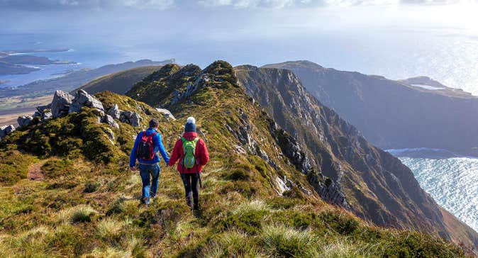 Two people hiking on the Slieve League Cliffs, Donegal