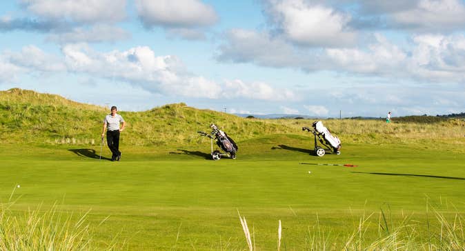 Three golfers at Ballyliffin Golf Course in County Donegal