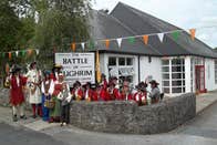 People in historical costume outside the Battle of Aughrim Visitor Centre