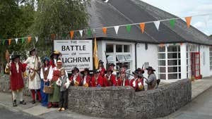 People in historical costume outside the Battle of Aughrim Visitor Centre