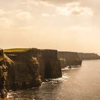 A side view of cliffs stretching into the distance