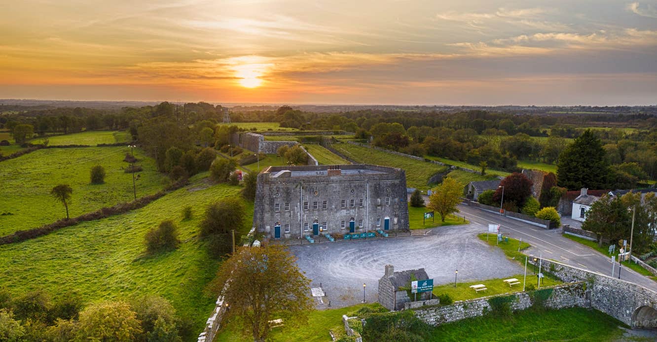 An aerial view of Shannon Fortifications with the sun setting behind the building