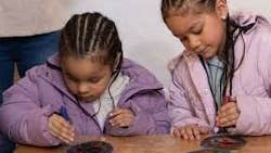 Children engaging with arts and crafts activity