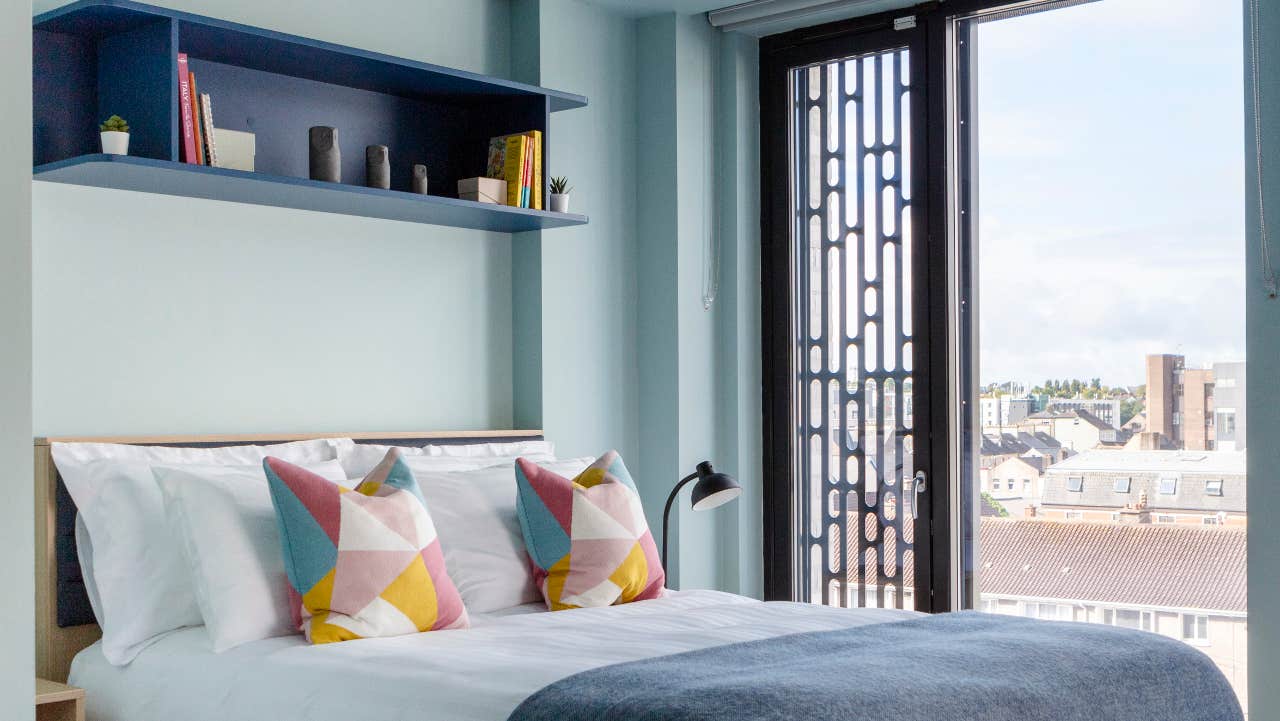 Bedroom with double bed and window.