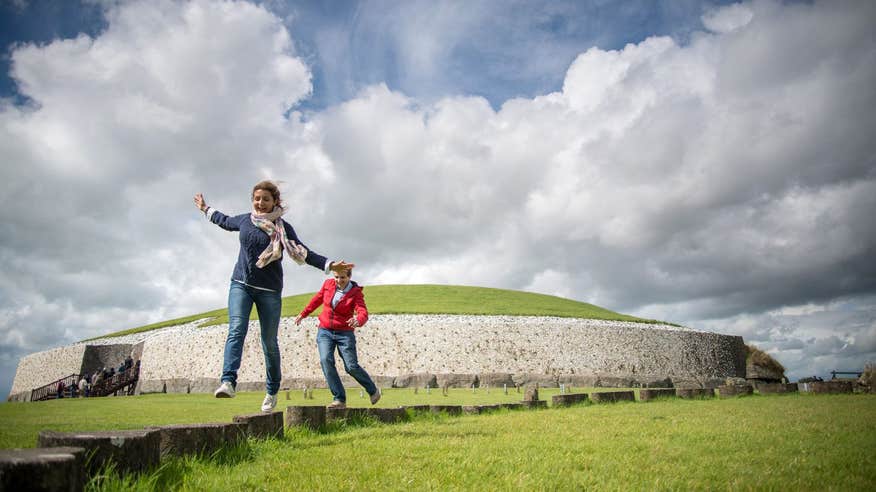 People playing outside Newgrange in County Meath