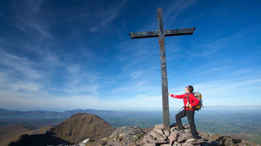 Person standing at the summit of Carrauntoohil, Co Kerry