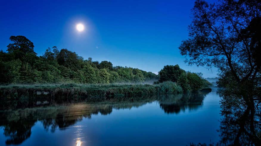 Full moon shining brightly over the River Boyne at night time