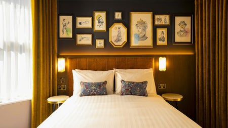 Double bed with white sheets