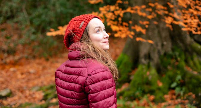 A woman in a forest in autumn