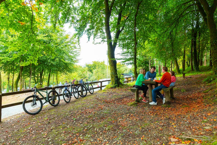 A family of four taking a break from cycling on the Ballyhoura Mountain Bike Trails in County Limerick.